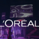 L'Oréal logo with a background illustrating the Digital Show project