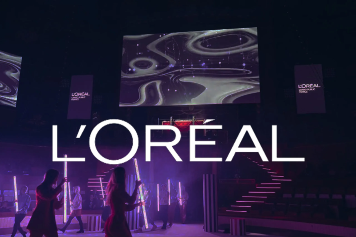 Logotipo de L'Oréal con un fondo que ilustra el proyecto Digital Show