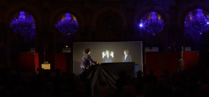 Speaker presenting with immersive digital technology and interactive visuals at a corporate event powered by Digital Show